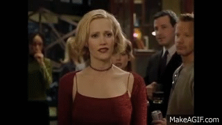 Woman in Red Dress Holding Drink
