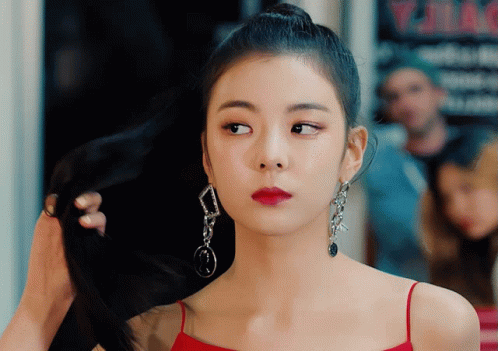 Woman In Red Dress Holding Hair Bun GIF