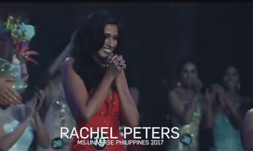 Woman in Red Dress Holding Microphone on Stage