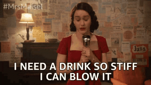 Woman in Red Dress Holding Microphone Saying I Need a Drink So Stiff