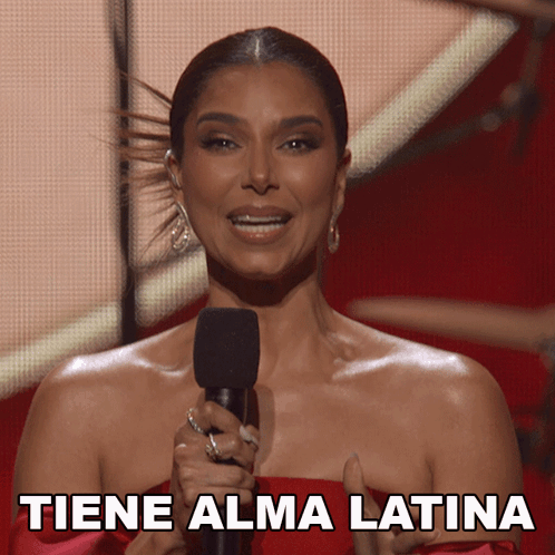 Woman in Red Dress Holding Microphone Tiene Alma Latina