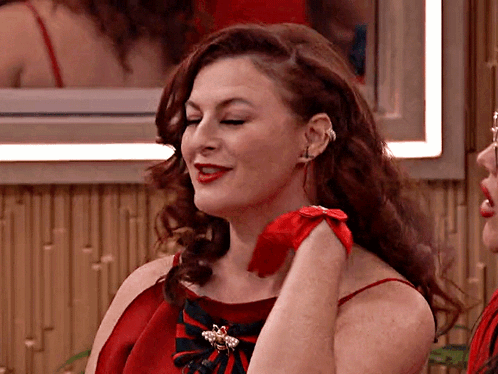 Woman in Red Dress Holding Red Rose