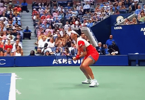 Woman In Red Dress Holding Tennis Racquet GIF