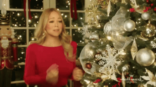 Woman in Red Dress in Front of Christmas Tree Hallmark Channel