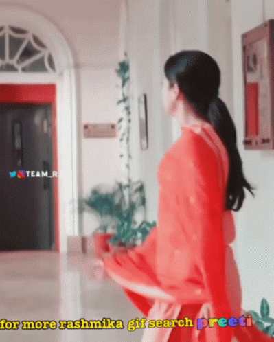 Woman In Red Dress In Hallway For More Rashmika GIF Search Preeti GIF