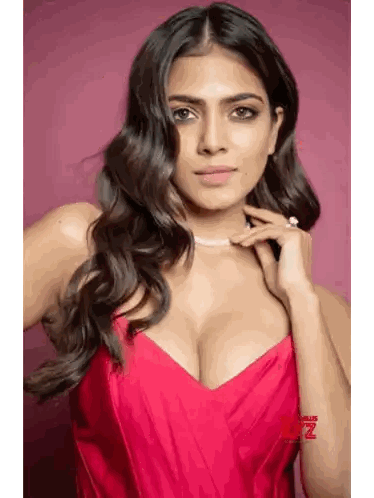 Woman in Red Dress Looking at Camera