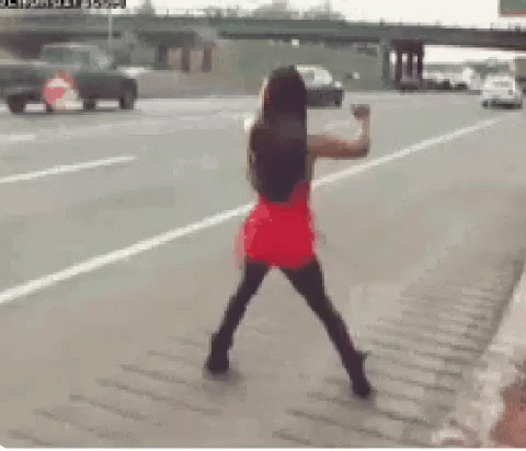 Woman in Red Dress on Roadside