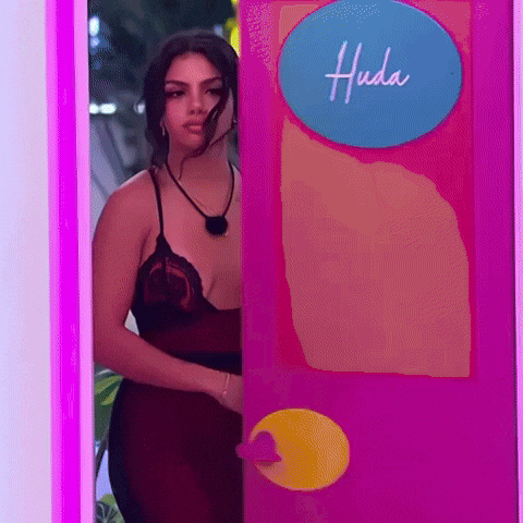Woman in Red Dress Peeking from Pink Door
