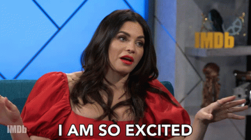 Woman in Red Dress Saying I Am So Excited Imdb Logo