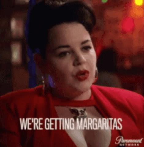 Woman in Red Dress Saying Margaritas