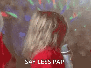 Woman in Red Dress Saying Say Less Papi