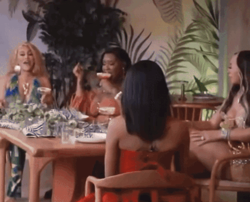 Woman In Red Dress Sitting With Three Women GIF
