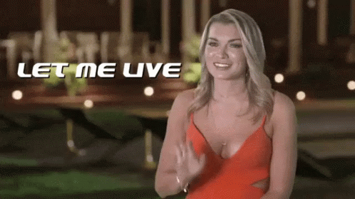 Woman in Red Dress Smiling and Waving