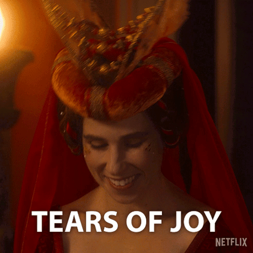 Woman In Red Dress Smiling Tears Of Joy GIF