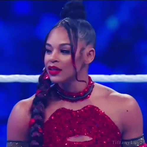 Woman In Red Dress Standing In Ring GIF