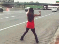 Woman In Red Dress Standing On Highway GIF