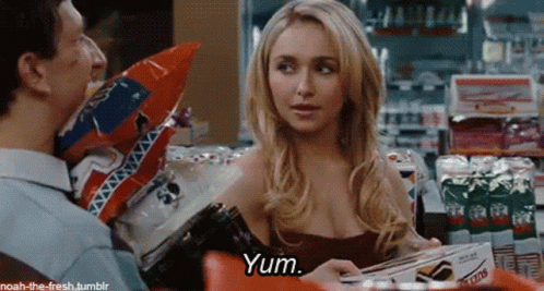 Woman In Red Dress Talking Saying Yum GIF