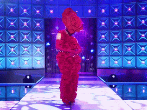 Woman in Red Dress Walking Down Stage