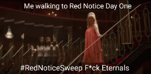 Woman in Red Dress Walking Down Stairs
