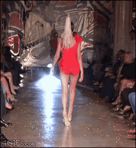 Woman in Red Dress Walking Runway