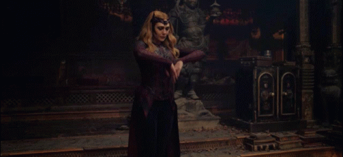 Woman In Red Dress With Red Light Hands GIF