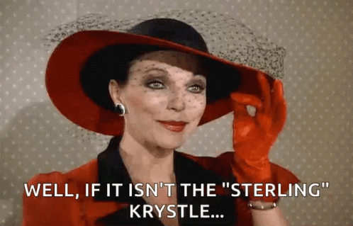 Woman in Red Hat and Gloves Saying Well