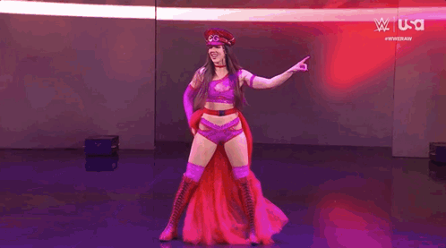 Woman in Red Hat and Purple Outfit Pointing