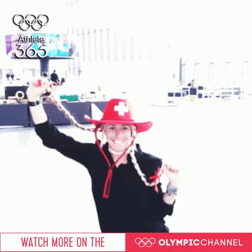 Woman In Red Hat With Swiss Cross And Athlete 365 Sign GIF
