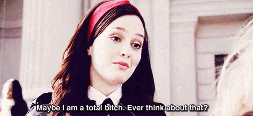 Woman In Red Headband Talking To Another Woman GIF