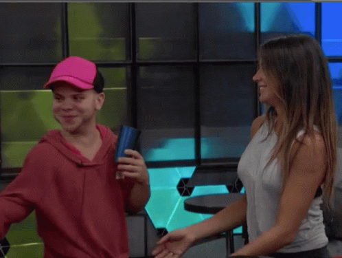 Woman In Red Hoodie Hugging Woman In White Tank Top GIF