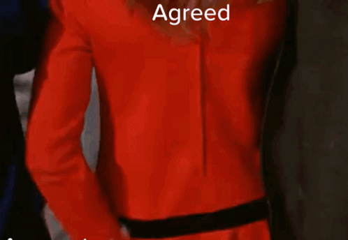 Woman In Red Jacket And White Gloves GIF