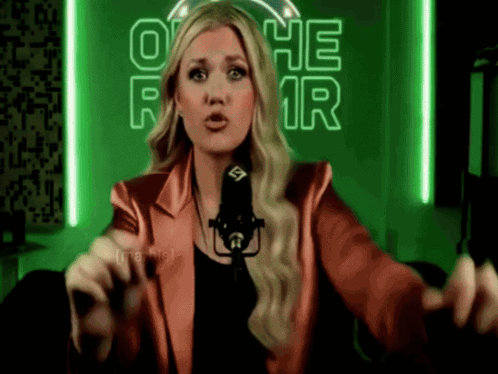 Woman In Red Jacket At Microphone GIF