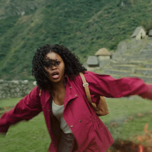 Woman In Red Jacket In Field GIF