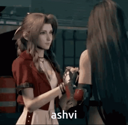 Woman in Red Jacket Saying Ashvi to Another