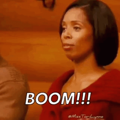 Woman in Red Jacket Saying Boom