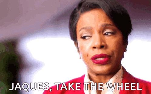 Woman In Red Jacket Says Jacques Take The Wheel GIF