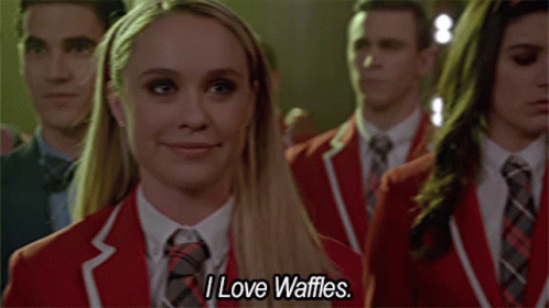 Woman in Red Jacket Smiling Says I Love Waffles