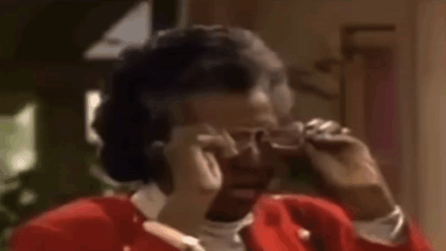 Woman in Red Jacket Talking on Cell Phone