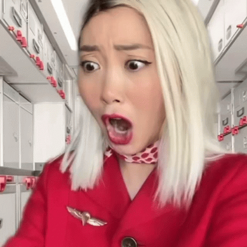 Woman in Red Jacket with Bird Badge