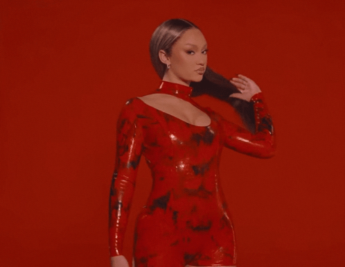 Woman in Red Latex Dress on Red Background