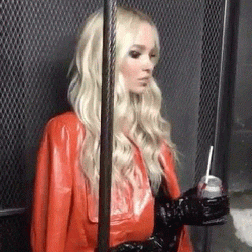 Woman in Red Leather Jacket Holding Soda
