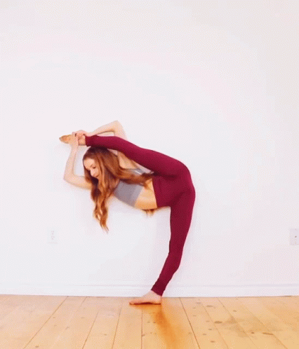 Woman In Red Leggings Doing Split GIF