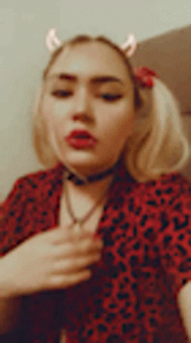 Woman in Red Leopard Shirt Removing Shirt