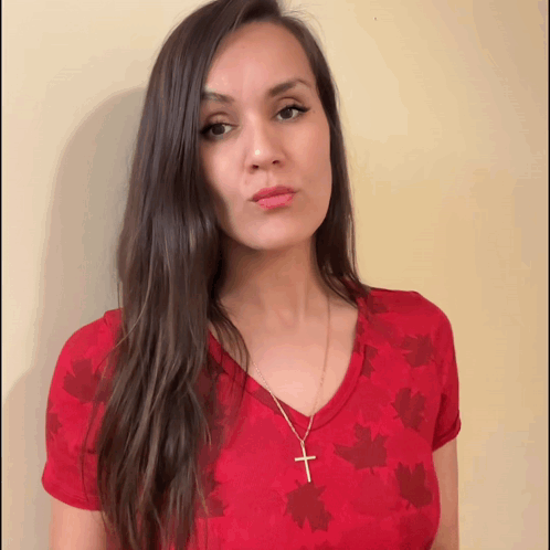 Woman in Red Maple Leaves Shirt Gold Cross