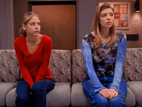 Woman in Red Next to Woman in Blue Tie Dye