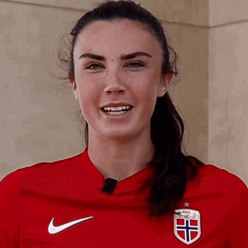 Woman in Red Nike Shirt Saying Norge