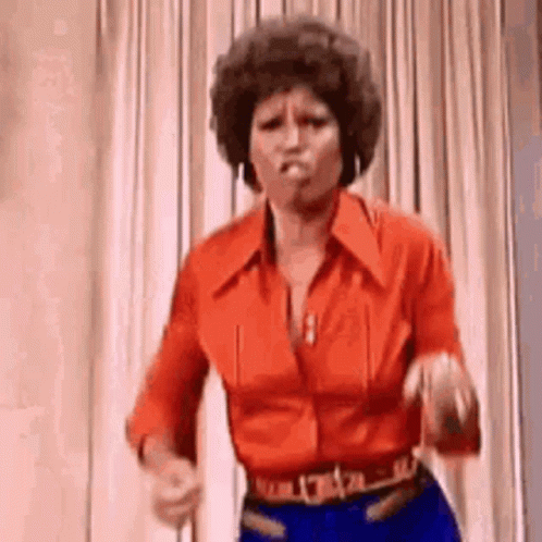 Woman in Red Shirt and Blue Jeans Dancing