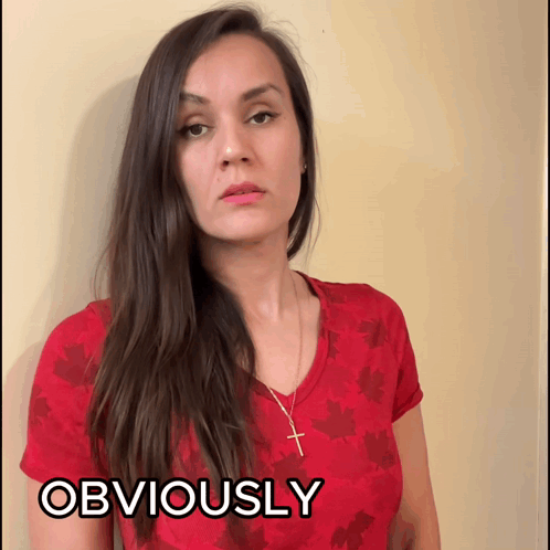 Woman in Red Shirt and Cross Necklace Saying Obviously