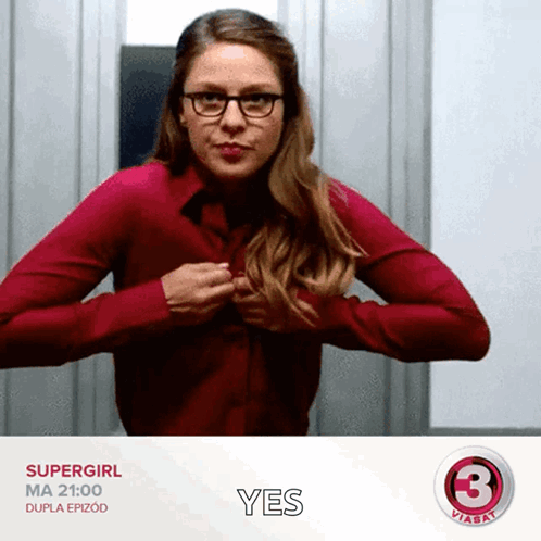 Woman in Red Shirt and Glasses Holding Chest Saying Yes
