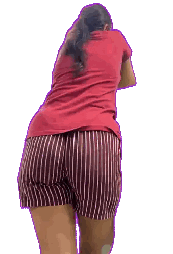 Woman in Red Shirt and Striped Shorts